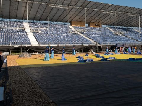 ictures of the rehearsals in front of the empty grandstand. On August 15, the grandstand was full with spectators.